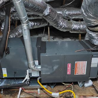 Client-supplied photo of attic heating equipment and ducts